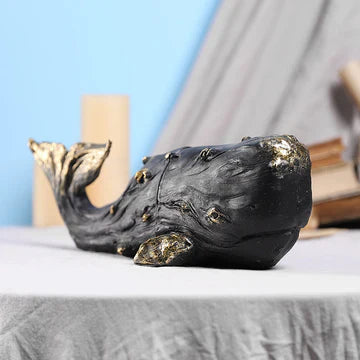 Make a Splash with This Black & Gold Whale Decor